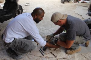 Salim and John cutting stones