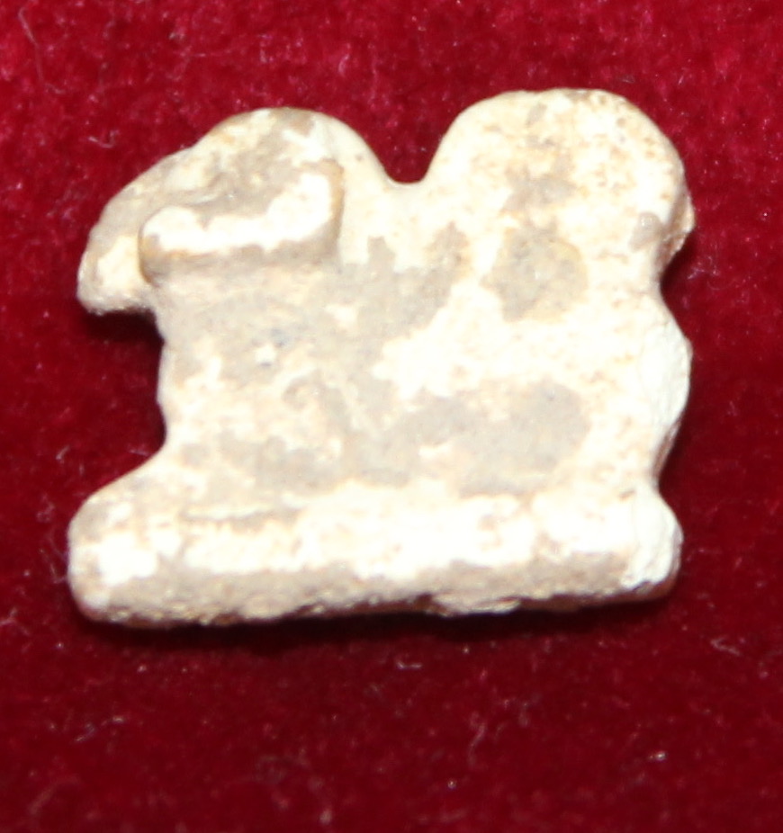 Tiny amulet showing a ram