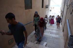 Local youth participants lead field school students on a tour of the Old City